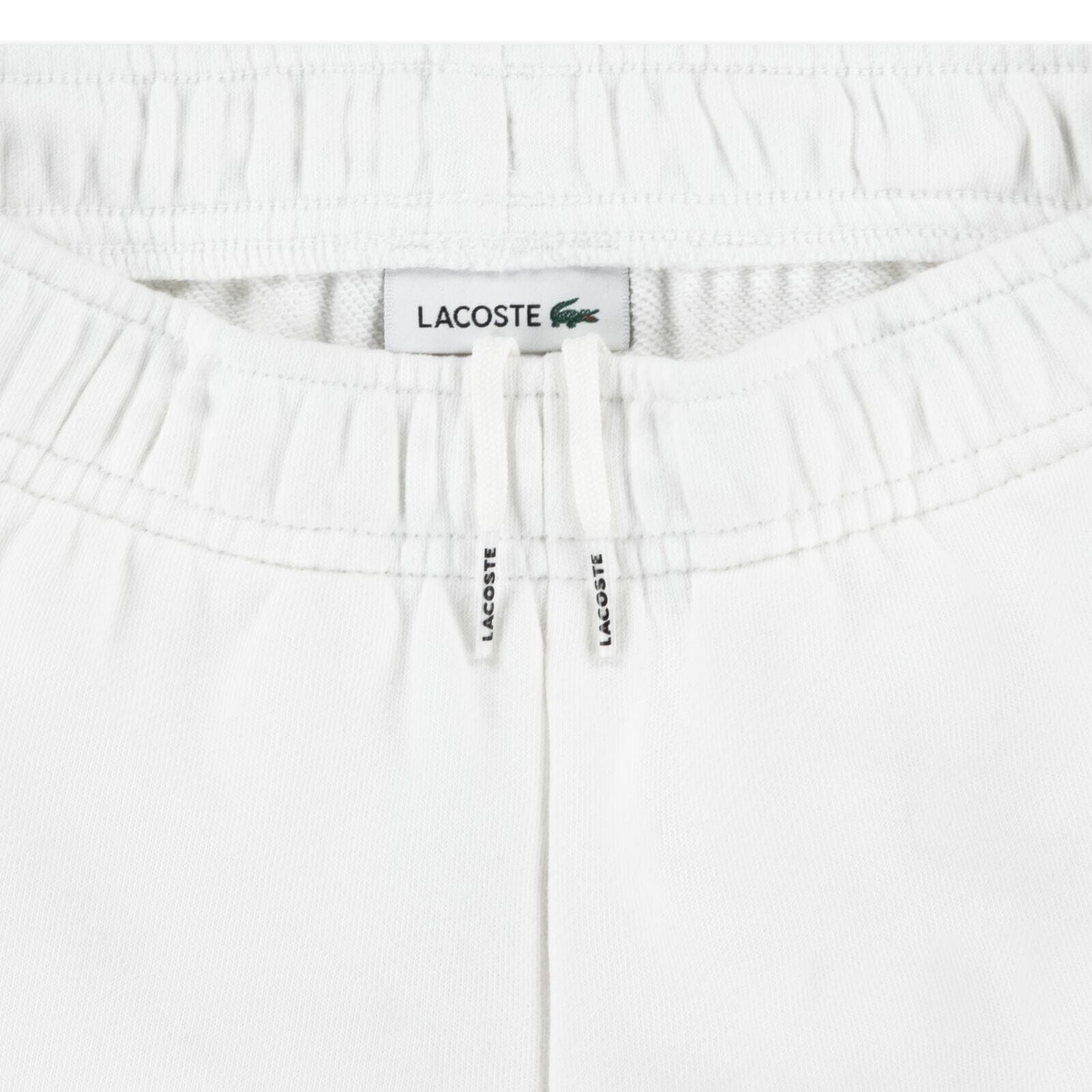 Lacoste Kinder Shorts mit Logo-Seitenstreifen in Weiß Shorts Lacoste